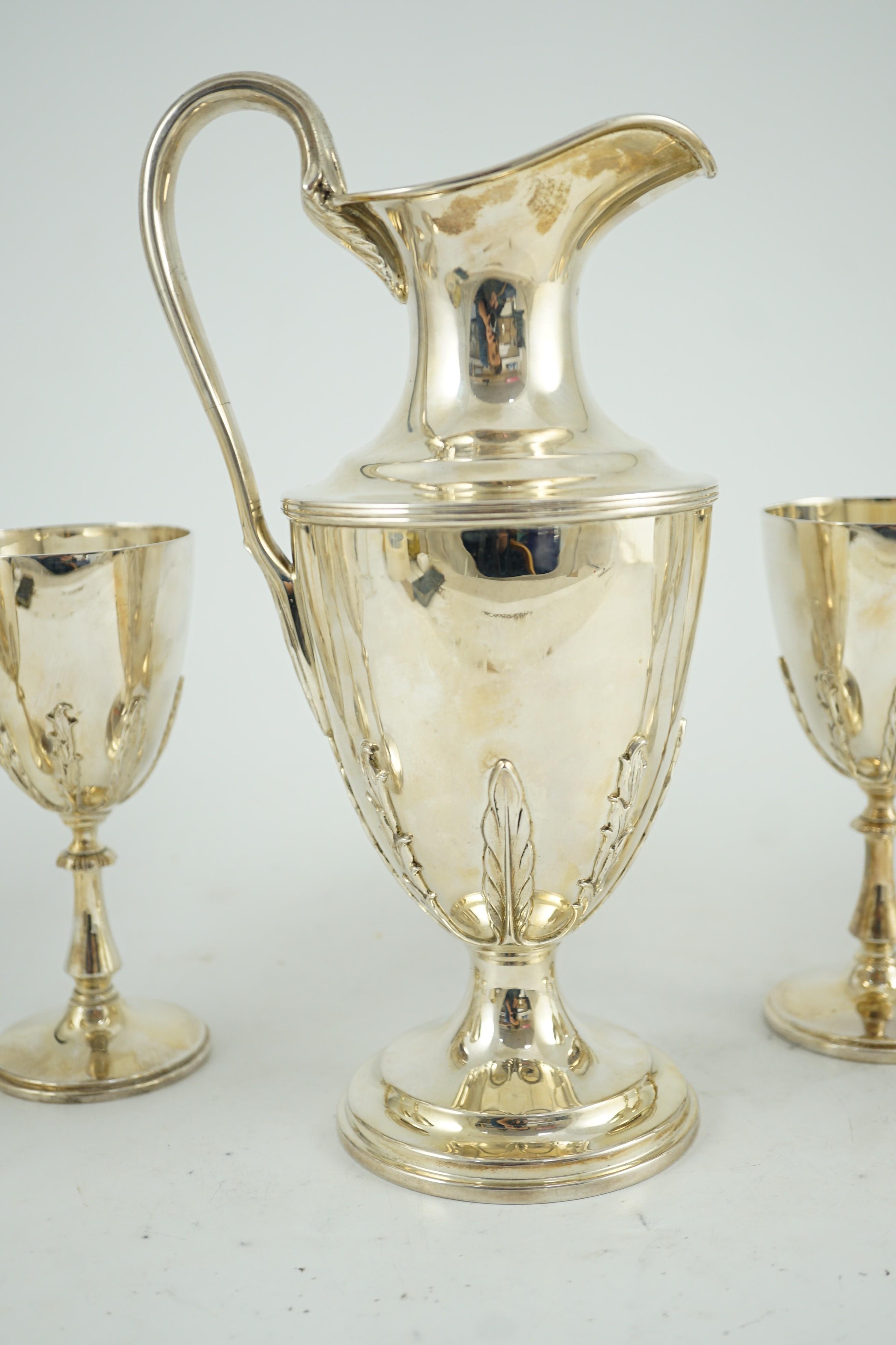 A modern cased silver ewer and six matching goblets by Courtman Silver Ltd